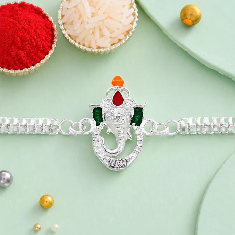 ALVENZA Shop Ganesha Rakhi with Silver Chain Enamel Highlights