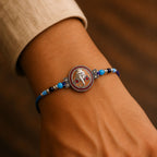 ALVENZA Round Ganesha Medallion Rakhi with Blue Thread, Roli Chawal Coin and Peacock Card Packing