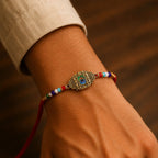 ALVENZA Antique Gold Peacock Feather Rakhi with Mor Pankh Centre and Multicolor Crystal Beads