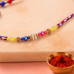 ALVENZA Rainbow Beaded Charm Rakhi with Colorful Festive Style and Playful Bracelet Look