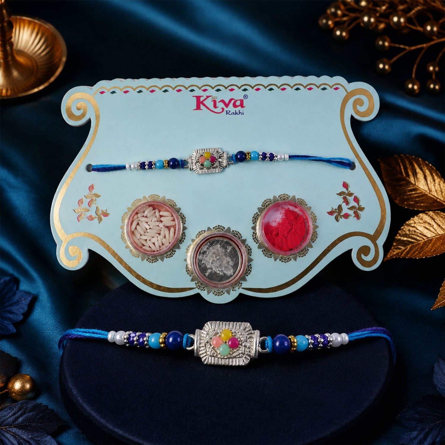 ALVENZA Silver Floral Stone Rakhi with Royal Blue Thread, Roli Chawal Coin and Card Gift Packing