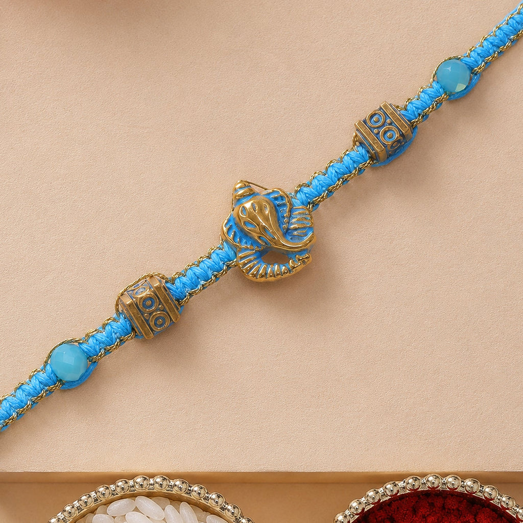 ALVENZA Turquoise Center Designer Rakhi with Gold Tone Detail and Elegant Bracelet Beauty