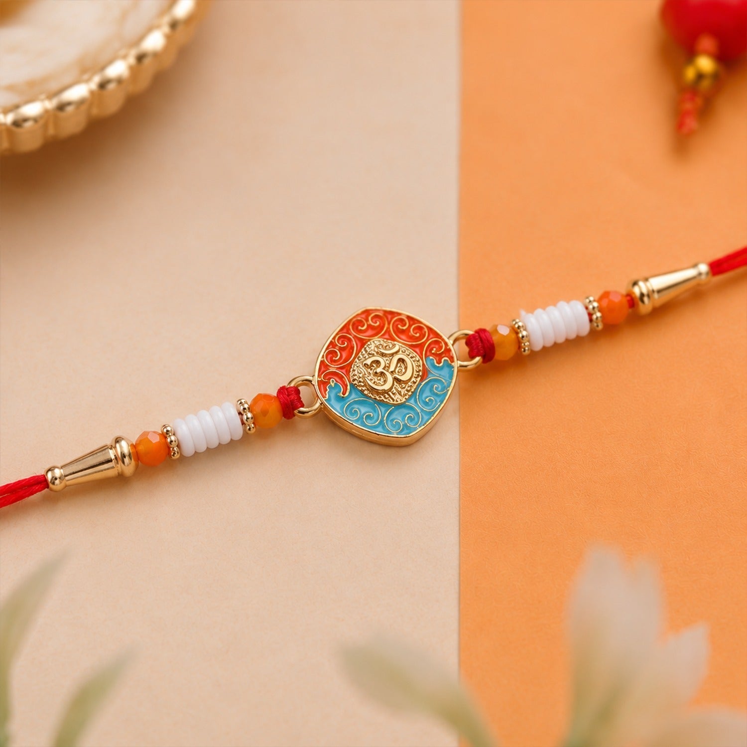 ALVENZA OM Symbol Rakhi – Traditional Style with Modern Elegance