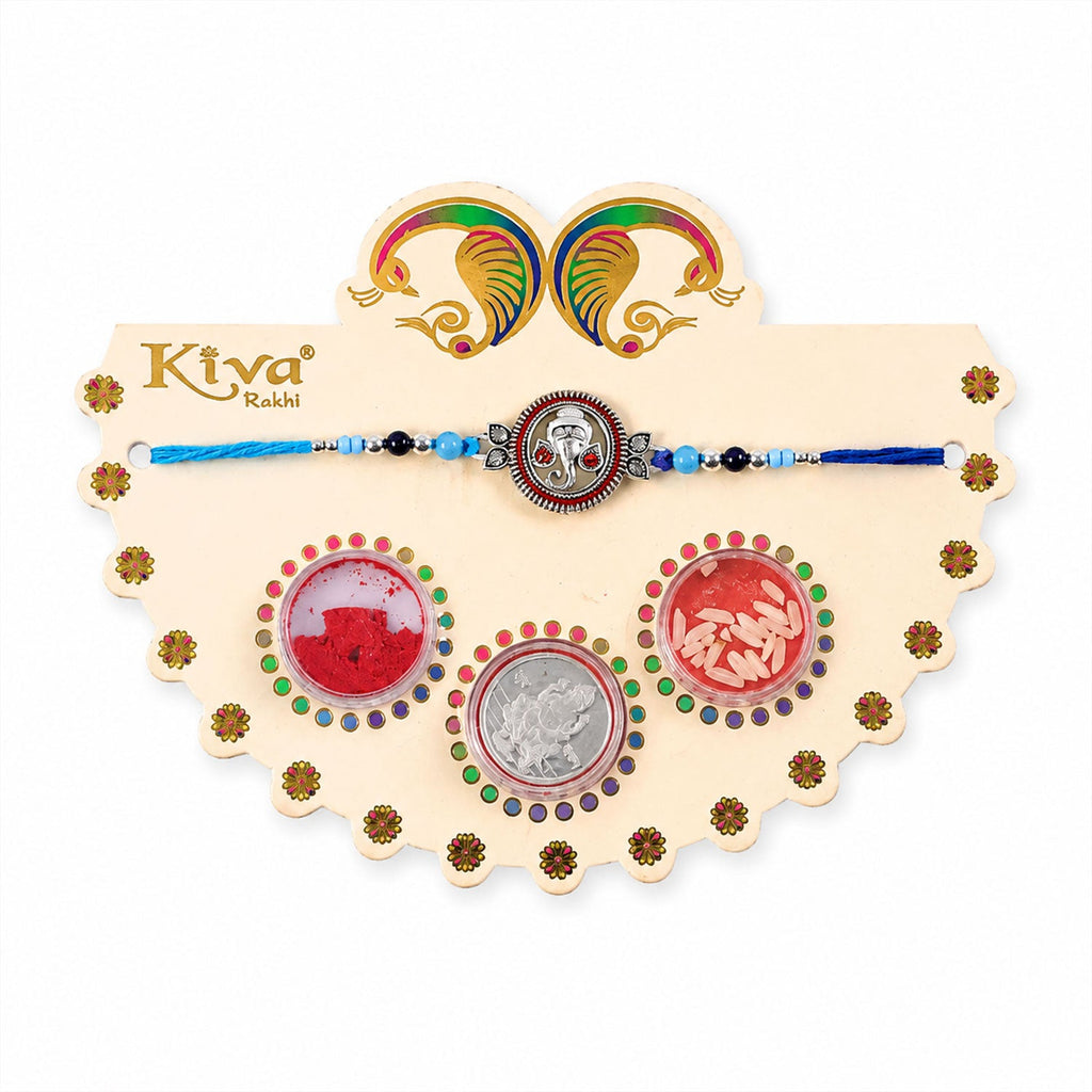 ALVENZA Round Ganesha Medallion Rakhi with Blue Thread, Roli Chawal Coin and Peacock Card Packing