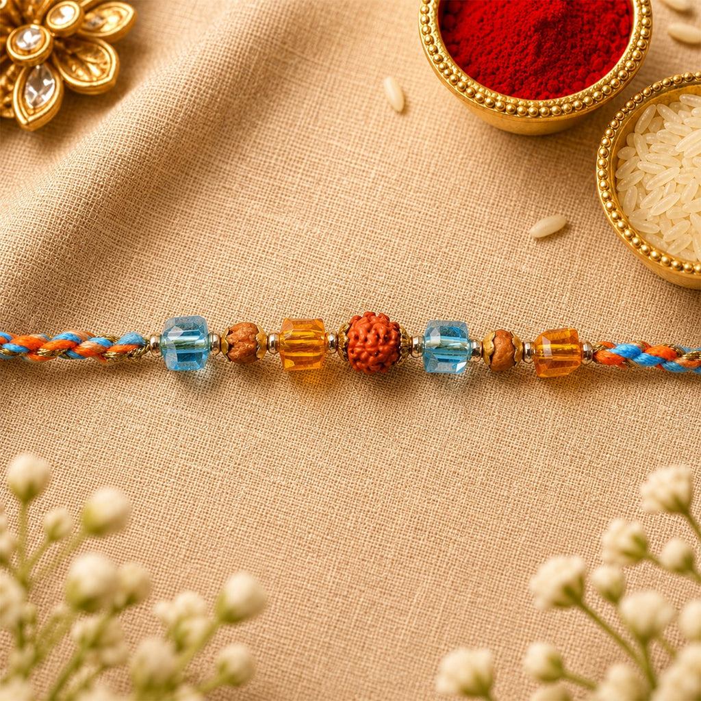 ALVENZA Blue Beaded Bracelet Rakhi with Golden Spacers and Colorful Festive Charm