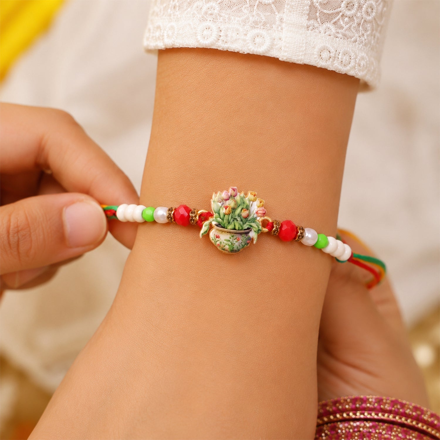 ALVENZA Auspicious Floral Kalash Devotional Rakhi for Brother with Beads Gift