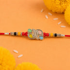 ALVENZA Silver Butterfly Leaf Rakhi with Pastel Stones, Roli Chawal Coin and Card Packing