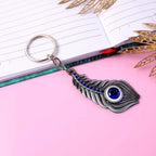 ALVENZA Peacock Feather Keychain – Elegant Metal with Blue Gem Accent