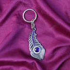 ALVENZA Peacock Feather Keychain – Elegant Metal with Blue Gem Accent