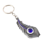 ALVENZA Peacock Feather Keychain – Elegant Metal with Blue Gem Accent