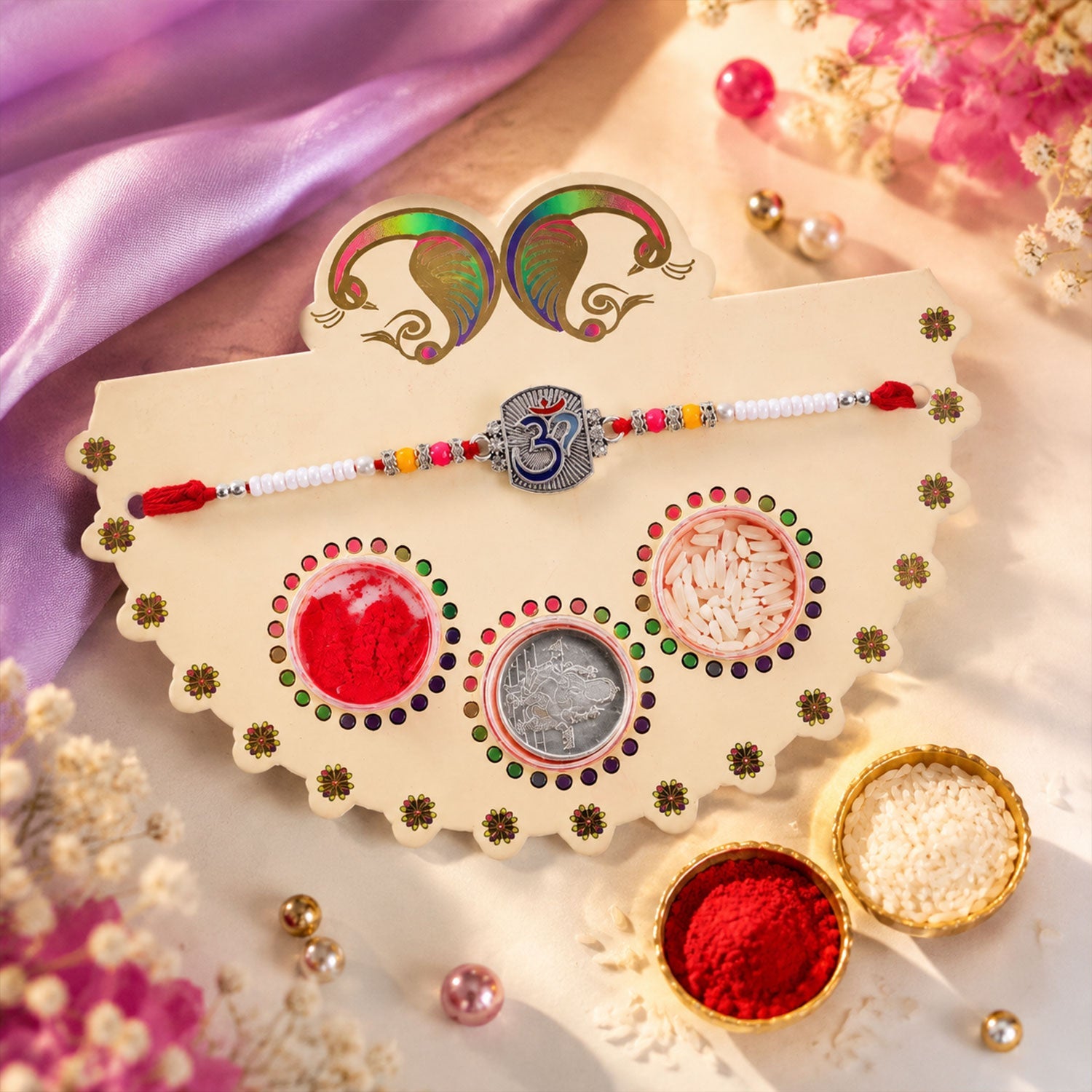 ALVENZA Om Symbol Silver Centre Rakhi with White Beads, Roli Chawal Coin and Peacock Gift Packing