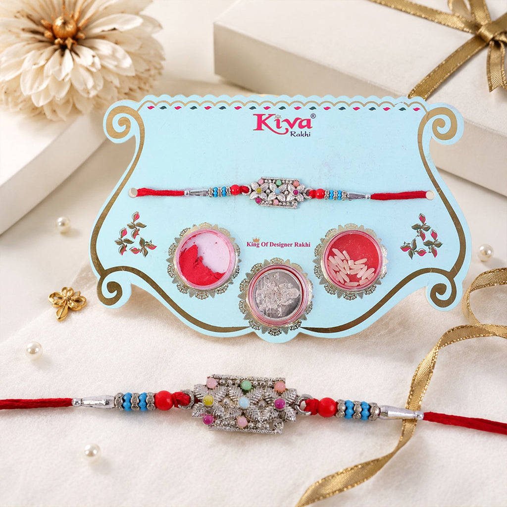 ALVENZA Rectangular Pearl Crystal Rakhi with Red Blue Beads, Roli Chawal Coin and Gift Packing