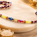 ALVENZA Rainbow Beaded Charm Rakhi with Colorful Festive Style and Playful Bracelet Look