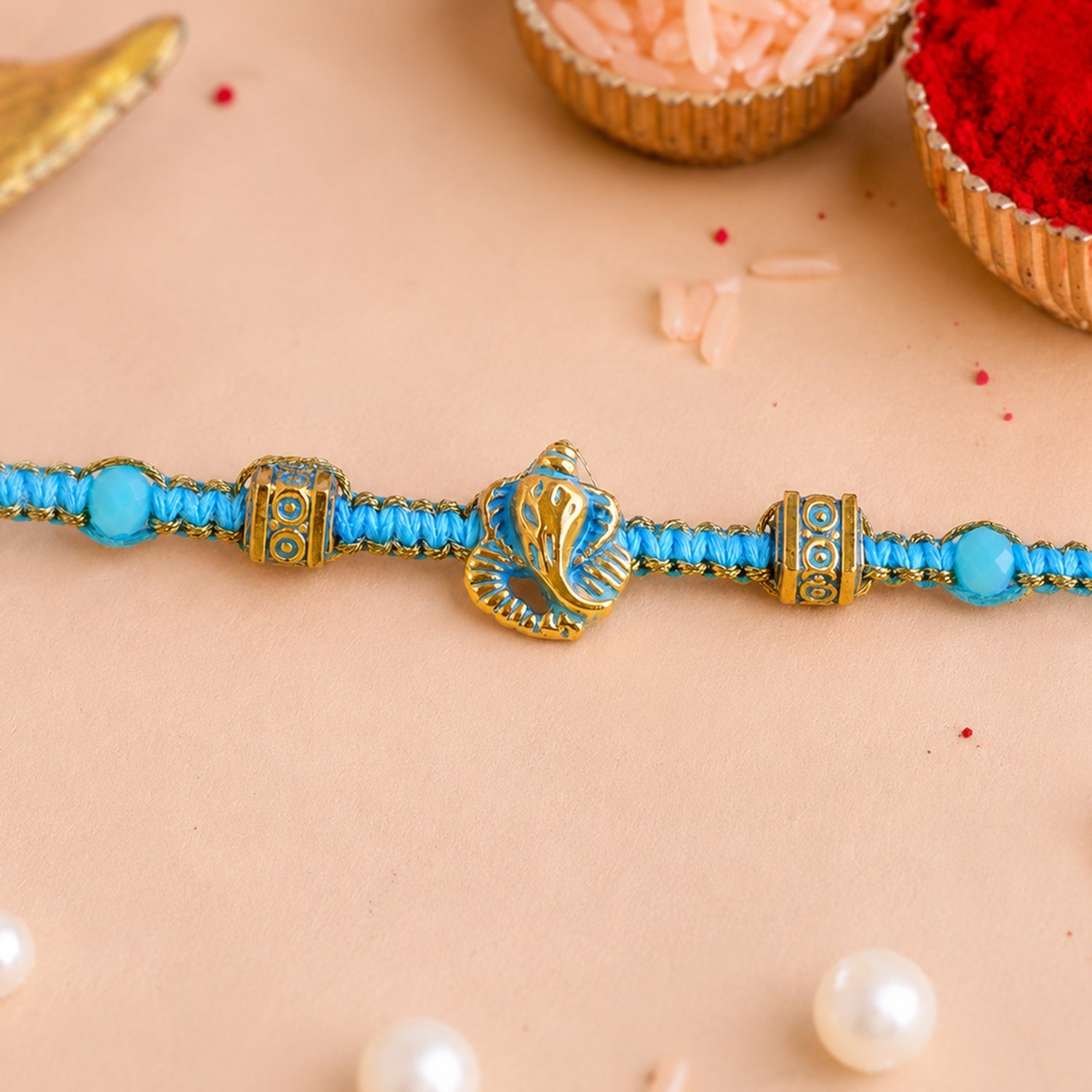 ALVENZA Turquoise Center Designer Rakhi with Gold Tone Detail and Elegant Bracelet Beauty