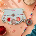 ALVENZA Sunburst Stone Rakhi with Magenta Centre, Pearl Beads, Roli Chawal Coin and Card Packing
