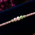 ALVENZA Pastel Pearl Bracelet Rakhi with Soft Pink Green Beads and Delicate Designer Beauty