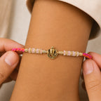ALVENZA Silver Tone Designer Rakhi with Pastel Beads and Elegant Bracelet Style Finish