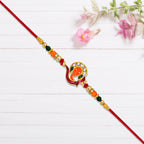 ALVENZA Golden Ganesha Rakhi – Red & Green Beads with Stone Detailing