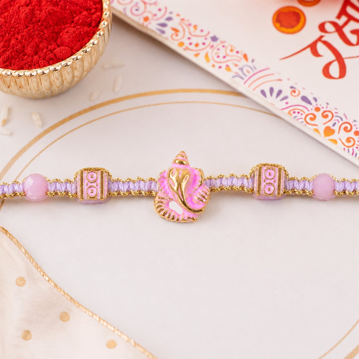 ALVENZA Pink Bracelet Designer Rakhi with Pearl Style Beads and Soft Festive Finish