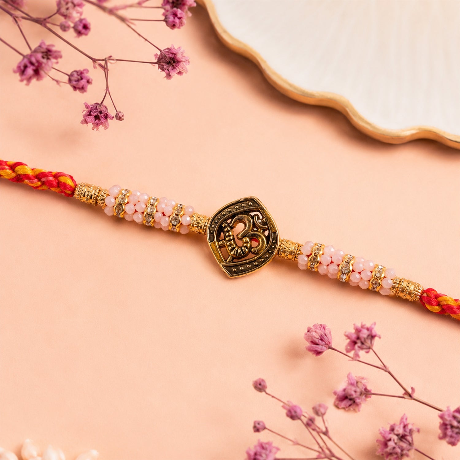 ALVENZA Silver Tone Designer Rakhi with Pastel Beads and Elegant Bracelet Style Finish