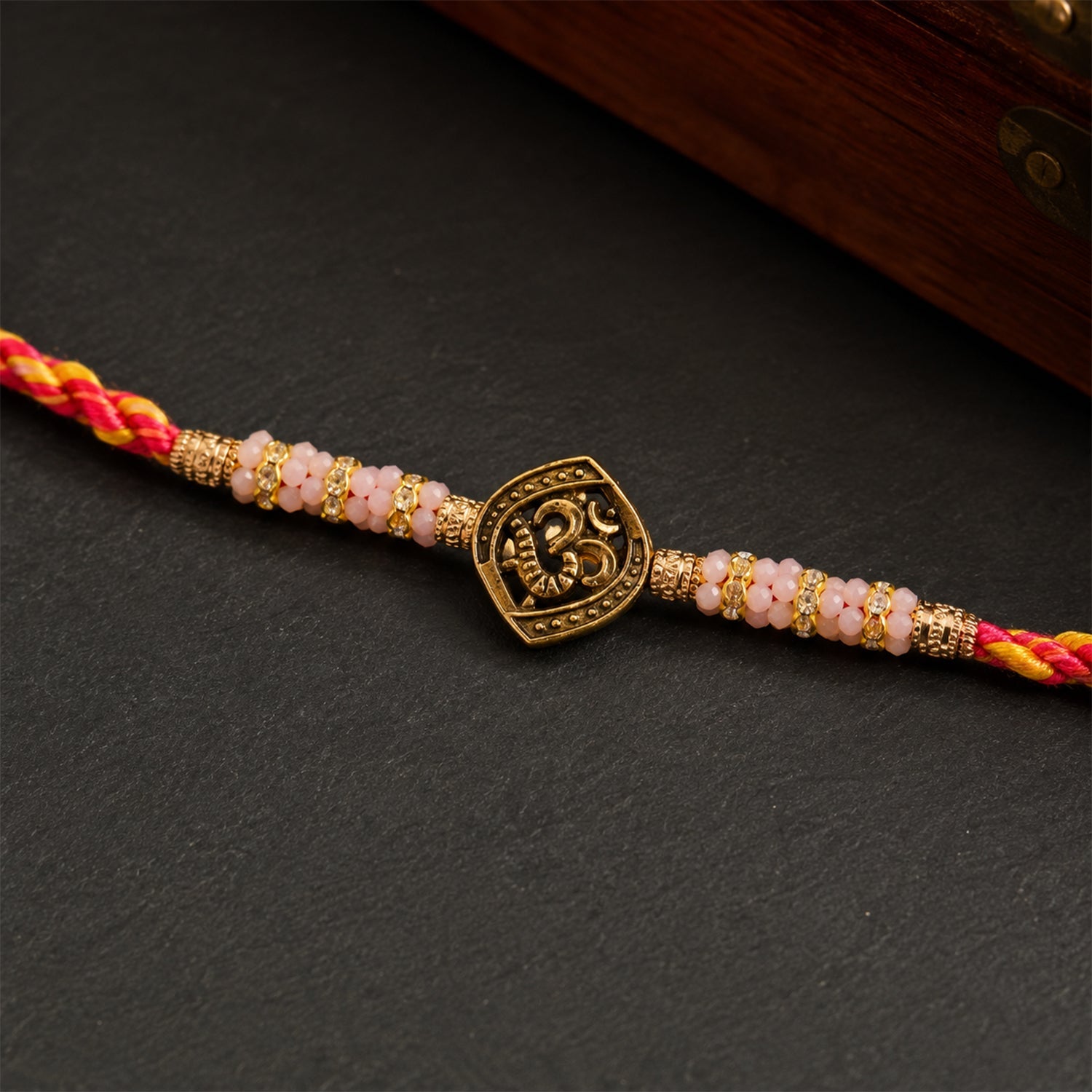 ALVENZA Silver Tone Designer Rakhi with Pastel Beads and Elegant Bracelet Style Finish