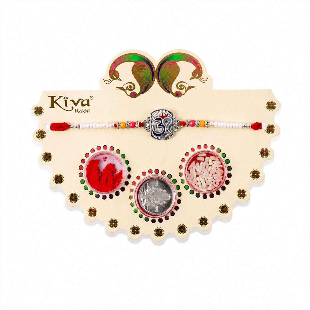 ALVENZA Om Symbol Silver Centre Rakhi with White Beads, Roli Chawal Coin and Peacock Gift Packing