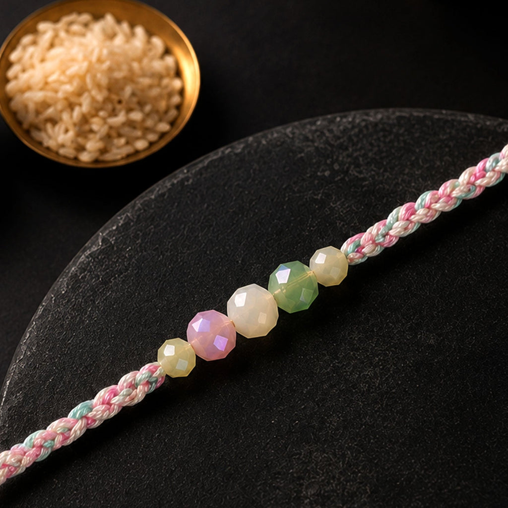 ALVENZA Pastel Pearl Bracelet Rakhi with Soft Pink Green Beads and Delicate Designer Beauty