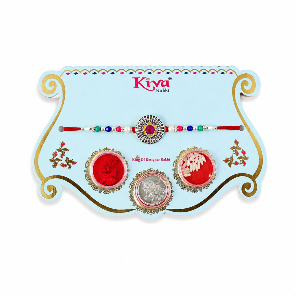ALVENZA Sunburst Stone Rakhi with Magenta Centre, Pearl Beads, Roli Chawal Coin and Card Packing