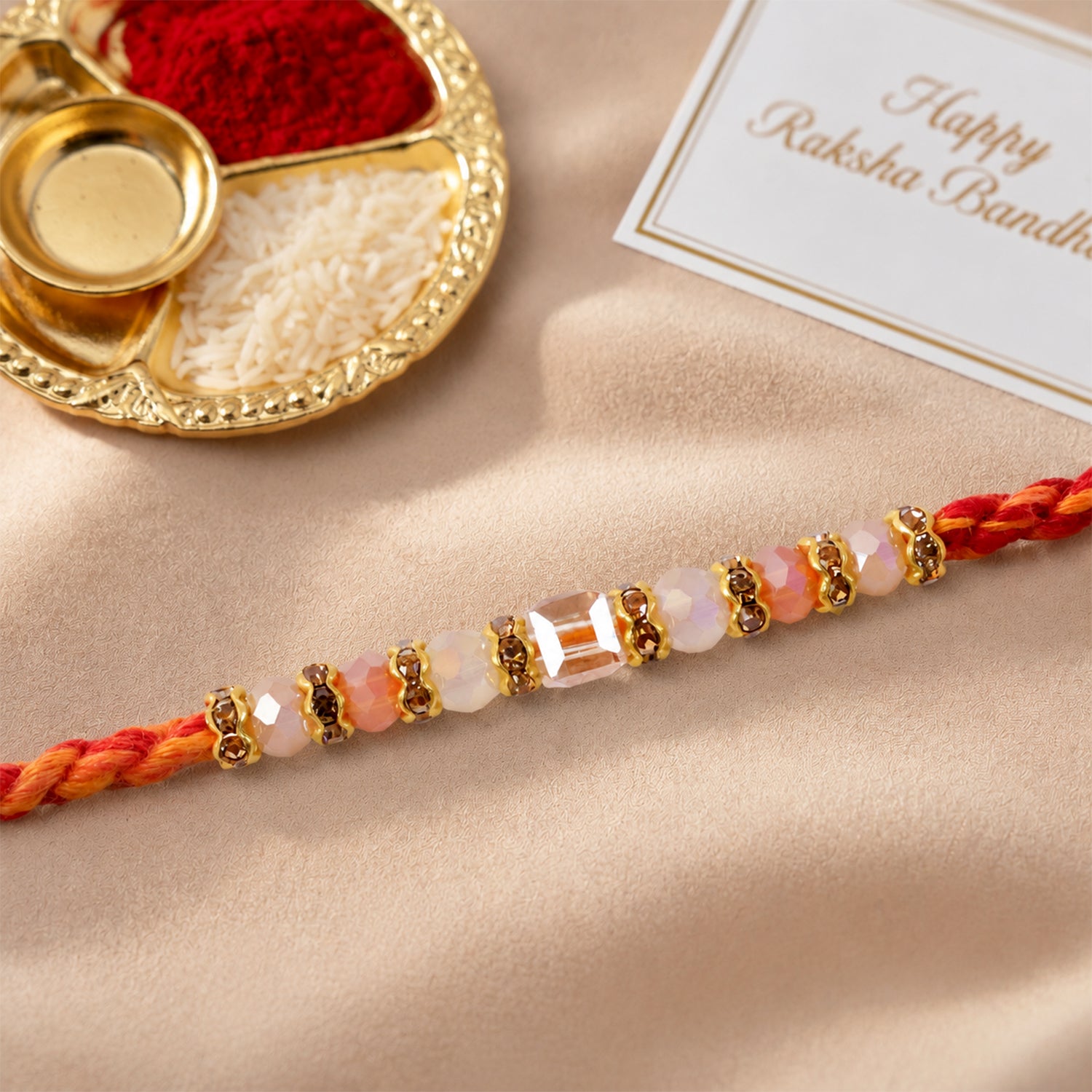 ALVENZA Silver Tone Designer Rakhi with Pastel Beads and Elegant Bracelet Style Finish