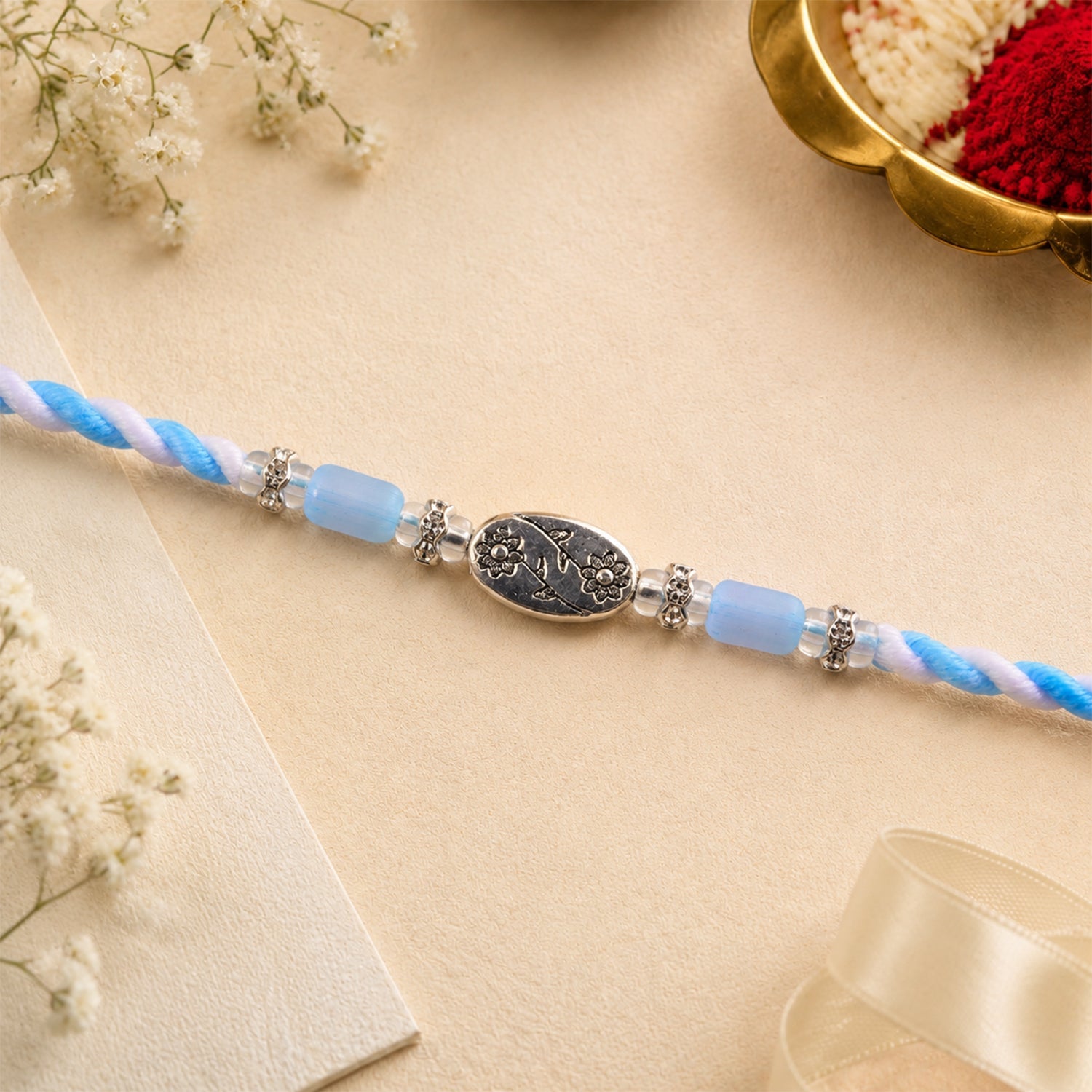 ALVENZA Blue Silver Stone Rakhi with Elegant Bracelet Style and Premium Festive Shine