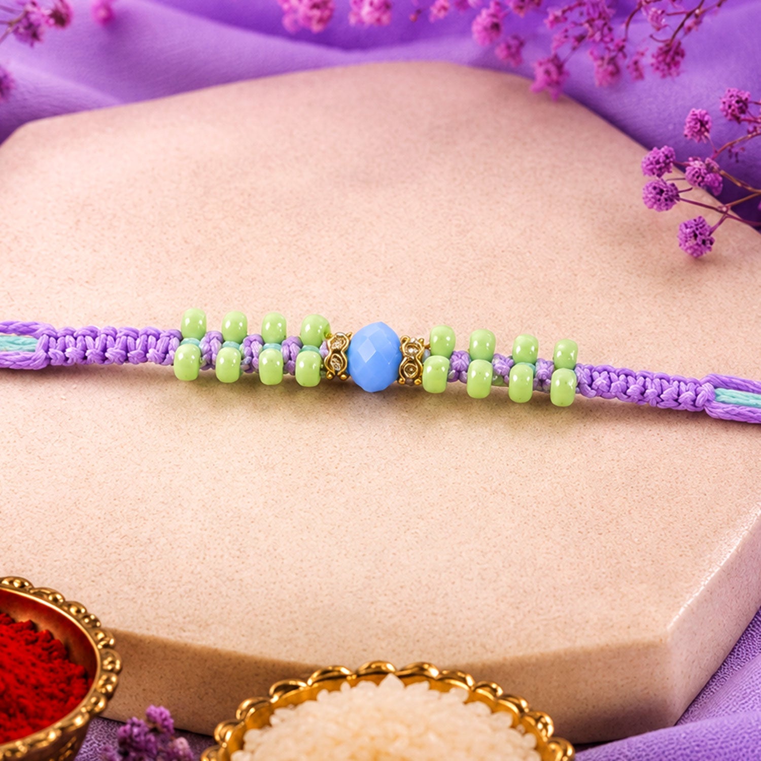 ALVENZA Purple Macrame Bracelet Rakhi with Green Beads, Blue Accent and Playful Thread