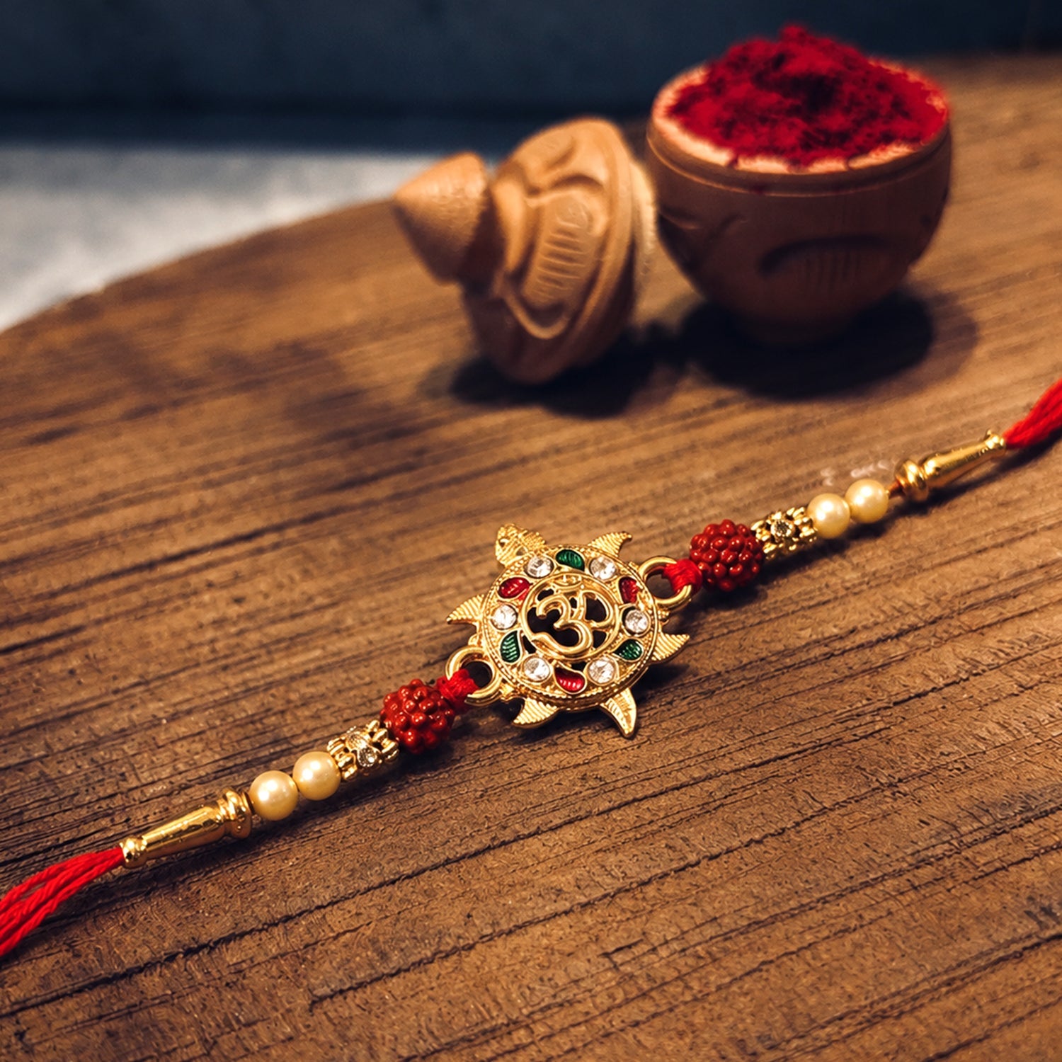 ALVENZA Divine Om Symbol Rakhi – Elegant Stones & Spiritual Design