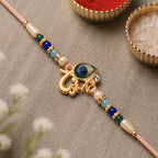 ALVENZA Peacock Rakhi – Divine Govind with Multicolor Beads for Raksha Bandhan