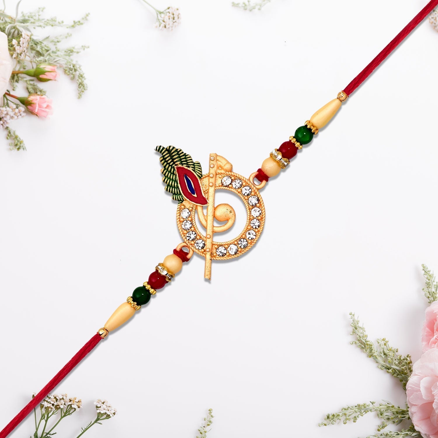 ALVENZA Krishna Flute Rakhi – Stone Studded Peacock Feather Design