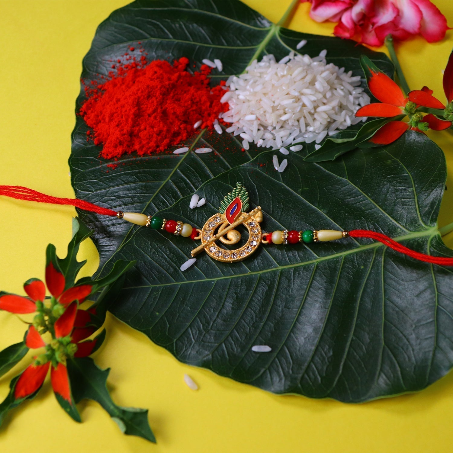 ALVENZA Krishna Flute Rakhi – Stone Studded Peacock Feather Design