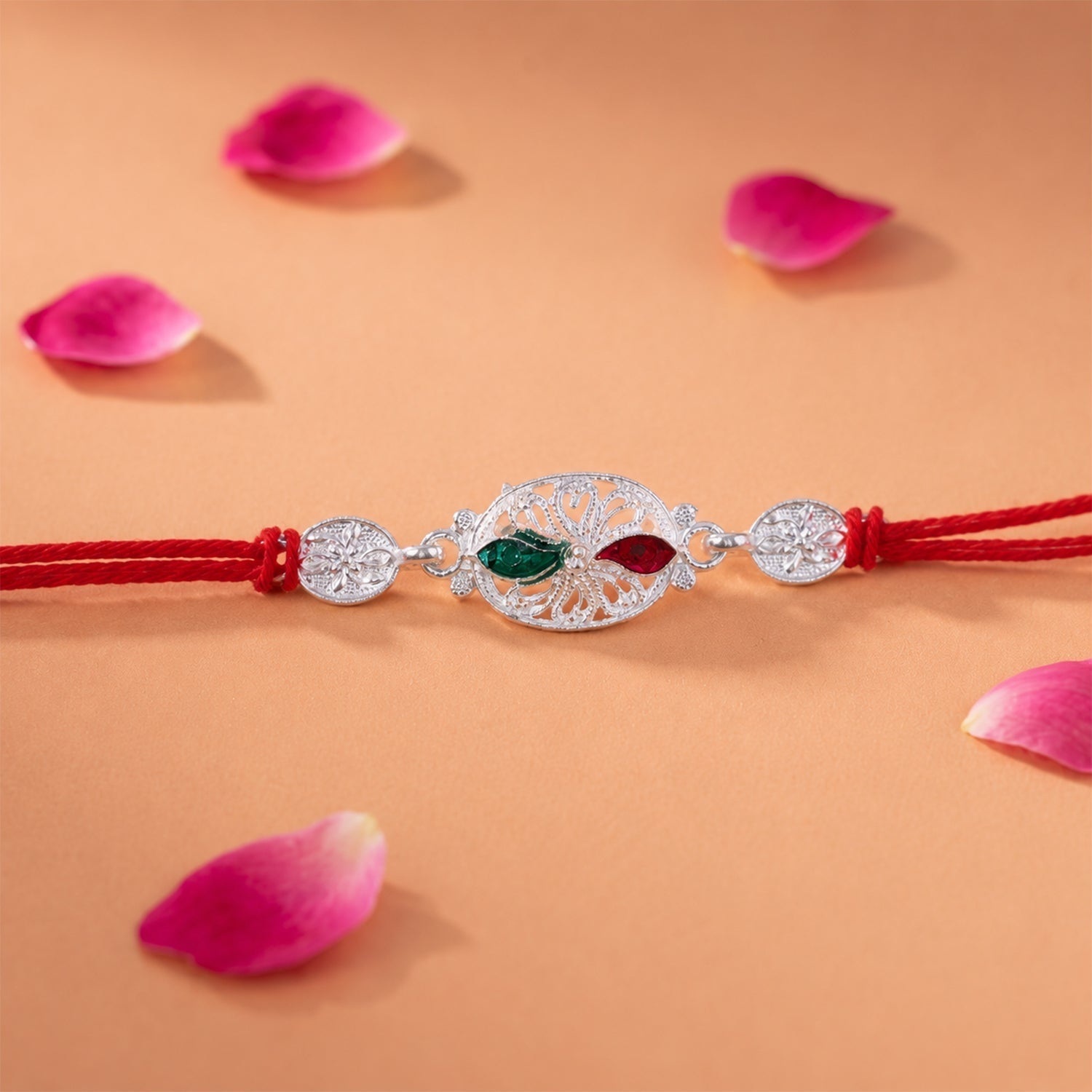ALVENZA Silver Oval Rakhi – Elegant Design with Red Thread