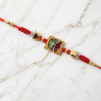 ALVENZA Traditional Square Motif Rakhi – Vibrant Red Beads & Elegant Design