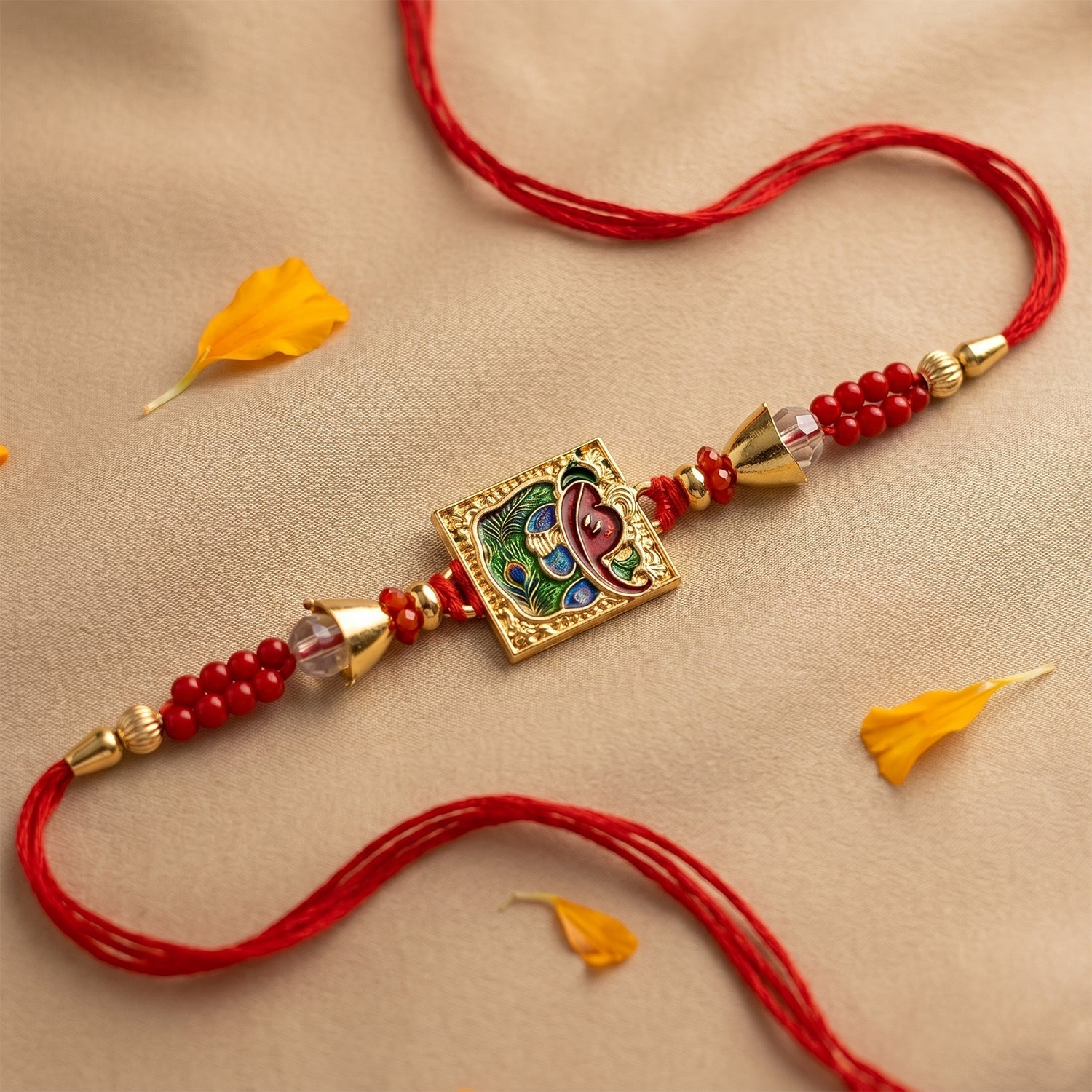 ALVENZA Traditional Square Motif Rakhi – Vibrant Red Beads & Elegant Design