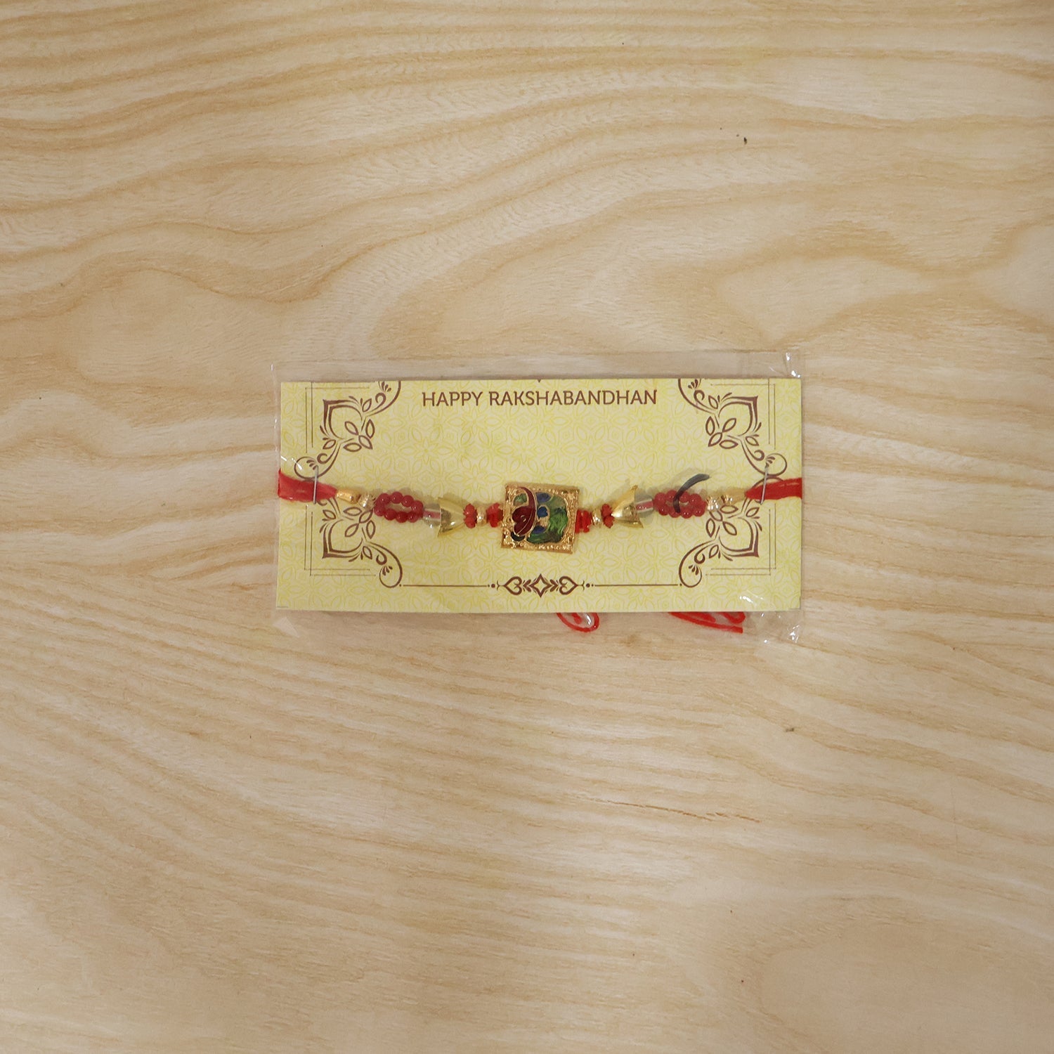 ALVENZA Traditional Square Motif Rakhi – Vibrant Red Beads & Elegant Design