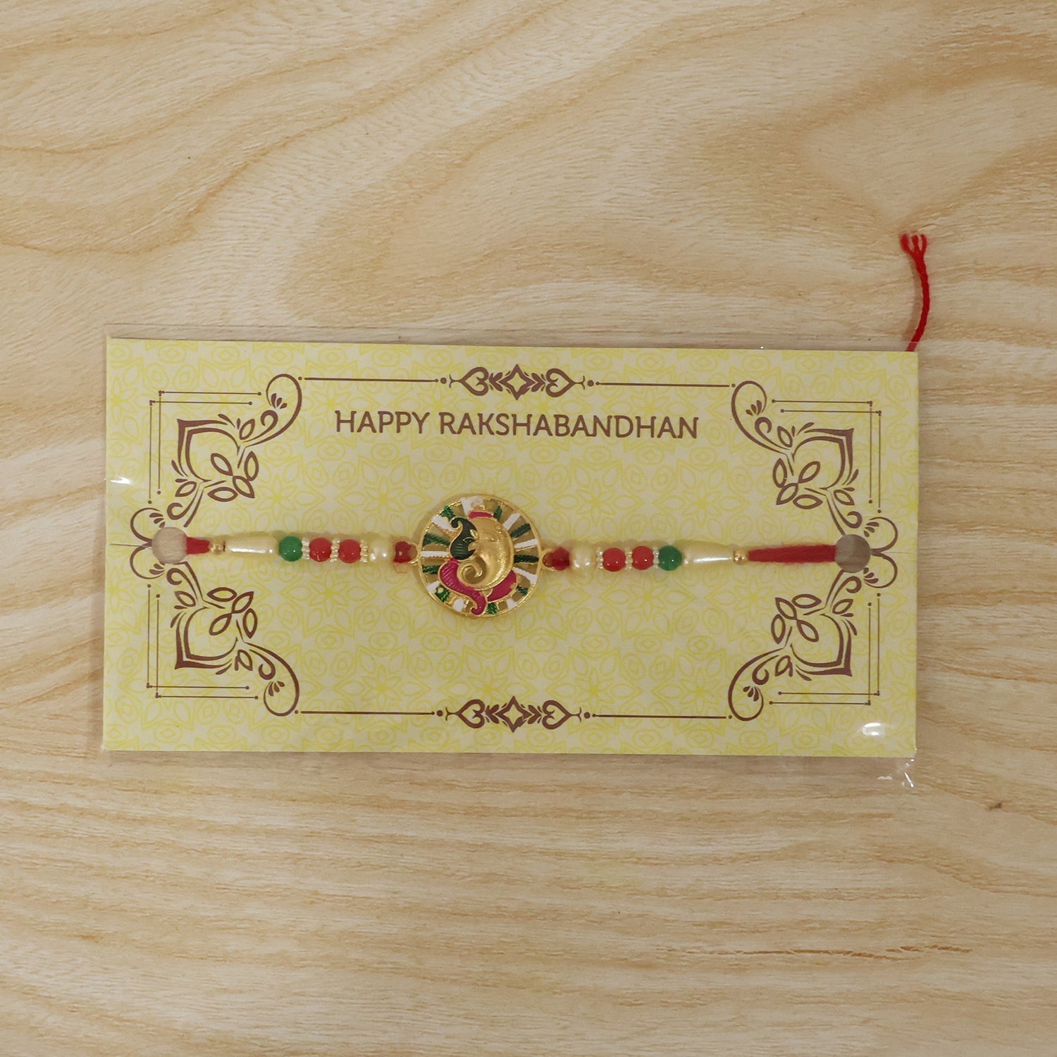 ALVENZA Rakhi – Traditional Thread with Colorful Beads & Ganesh Motif