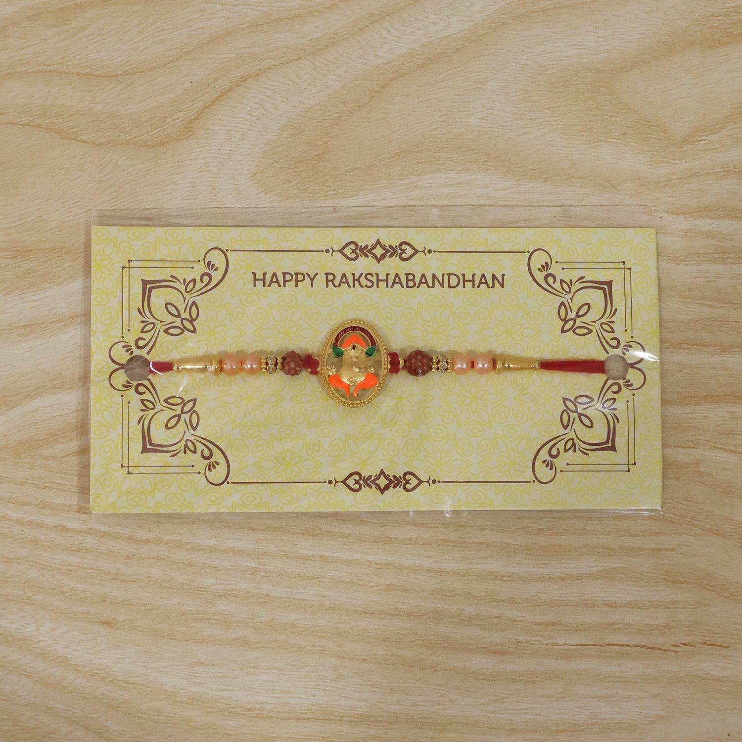 ALVENZA Ganesh Design Rakhi – Elegant Rudraksha Beads for Raksha Bandhan