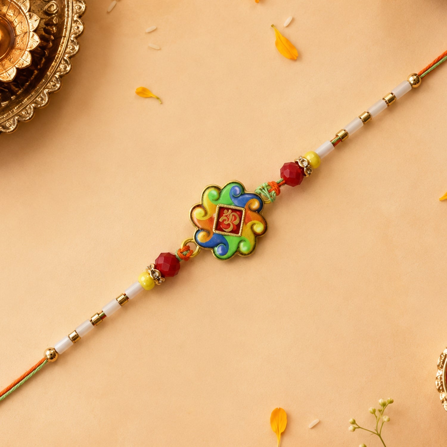 ALVENZA Colorful Om Rakhi – Vibrant Beaded Traditional Thread