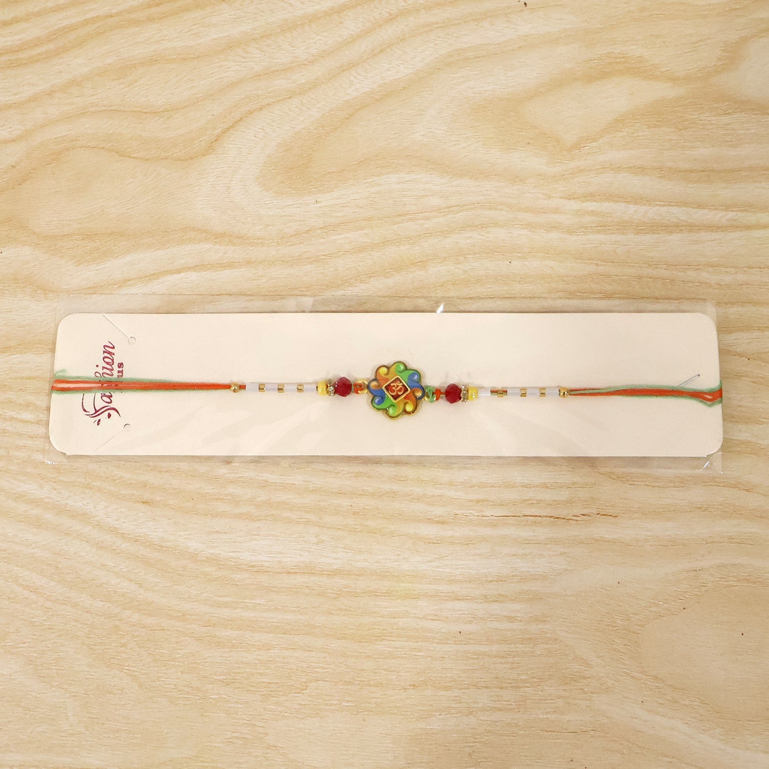 ALVENZA Colorful Om Rakhi – Vibrant Beaded Traditional Thread