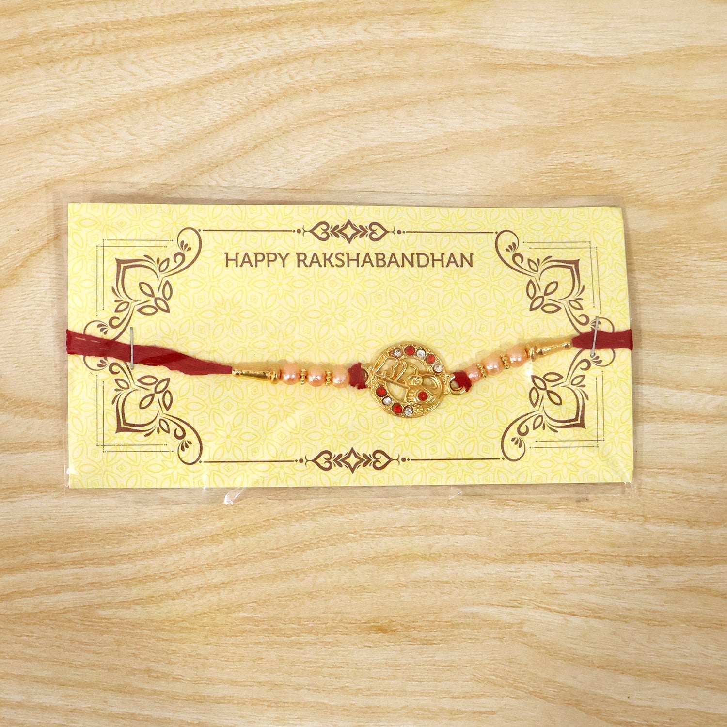 ALVENZA Rakhi – Elegant pearl bead design with red thread for siblings