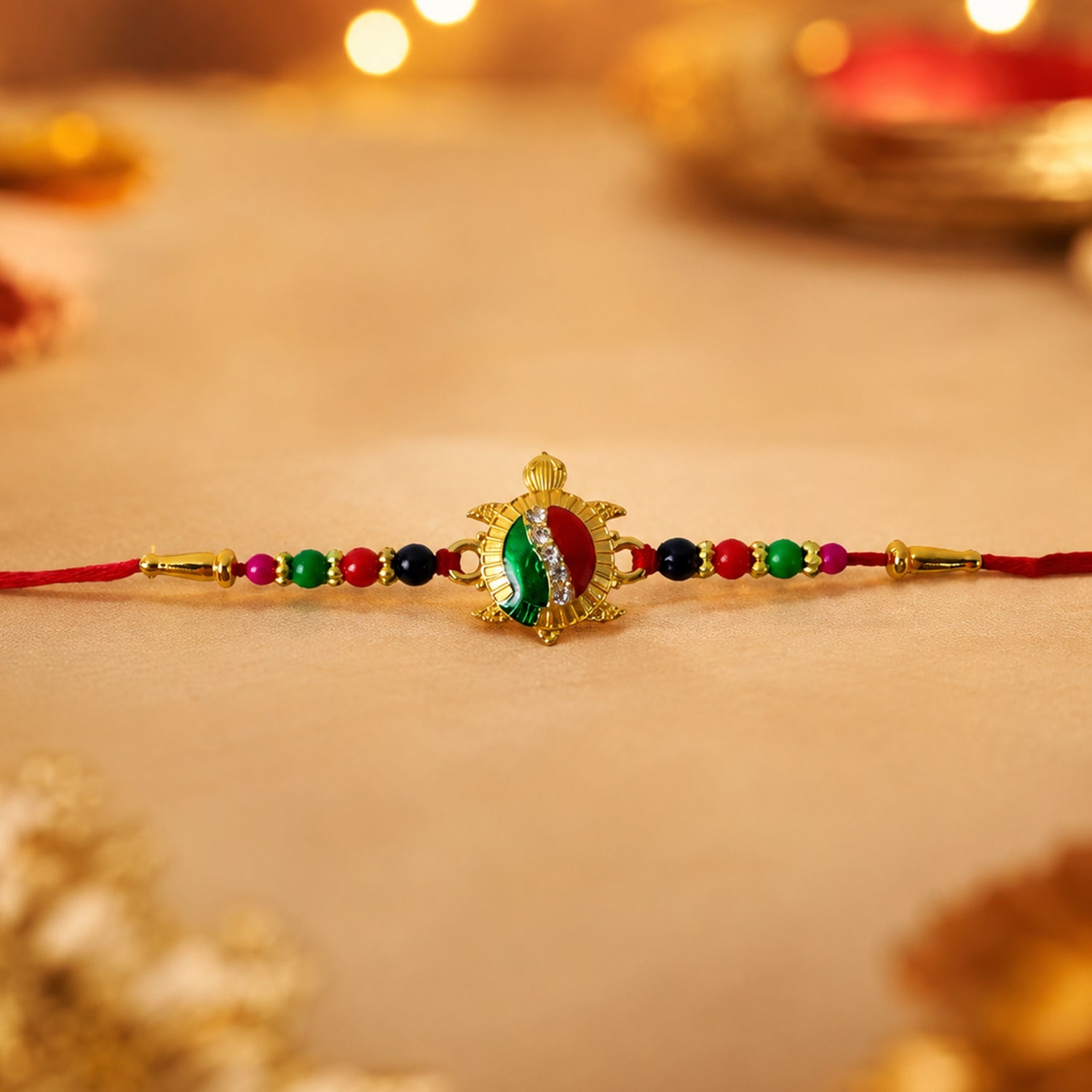 ALVENZA Rakhi – Elegant Turtle Design with Stone Work & Red Thread