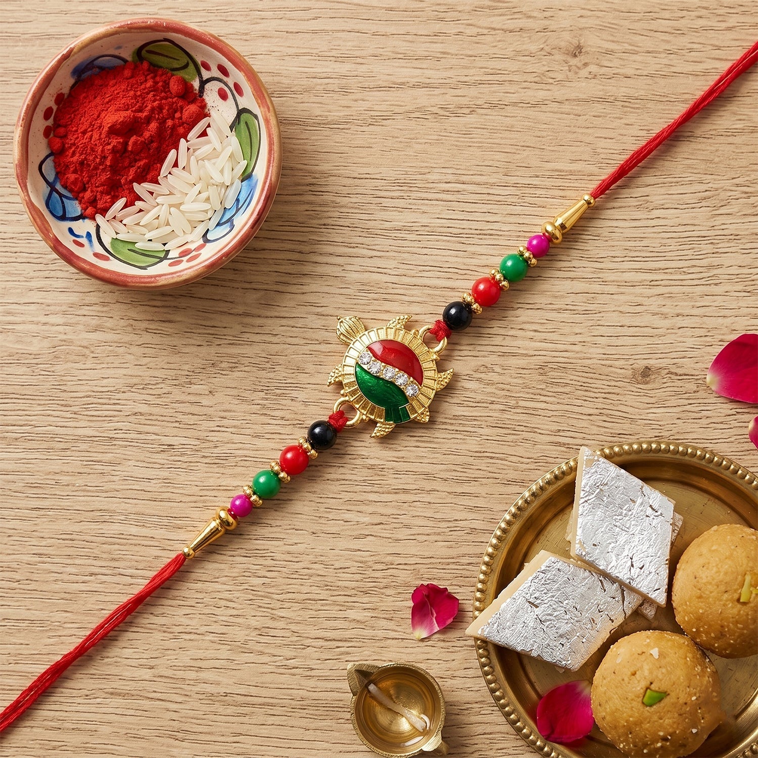 ALVENZA Rakhi – Elegant Turtle Design with Stone Work & Red Thread