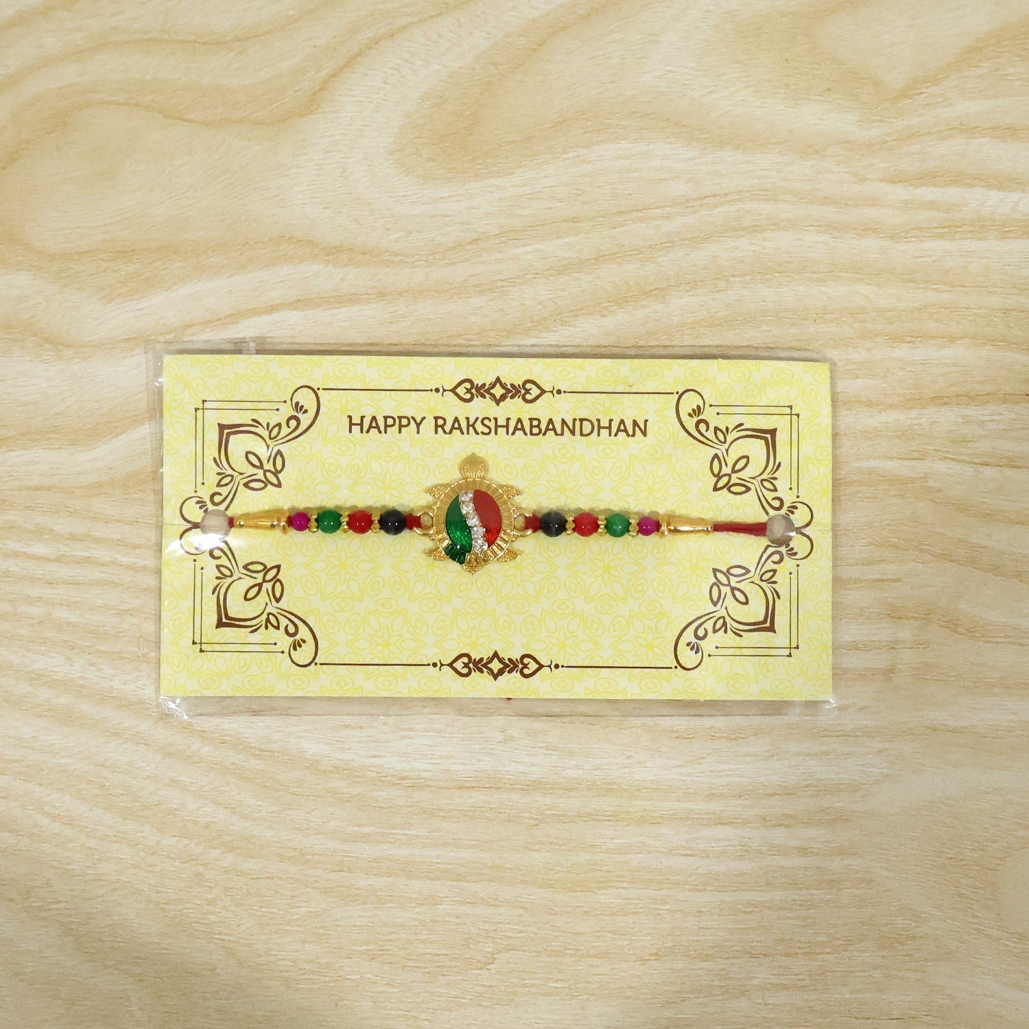 ALVENZA Rakhi – Elegant Turtle Design with Stone Work & Red Thread