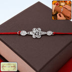 ALVENZA Silver Floral Om Rakhi – Elegant Red Thread for Rakshabandhan