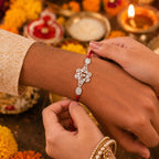 ALVENZA Silver Floral Om Rakhi – Elegant Red Thread for Rakshabandhan