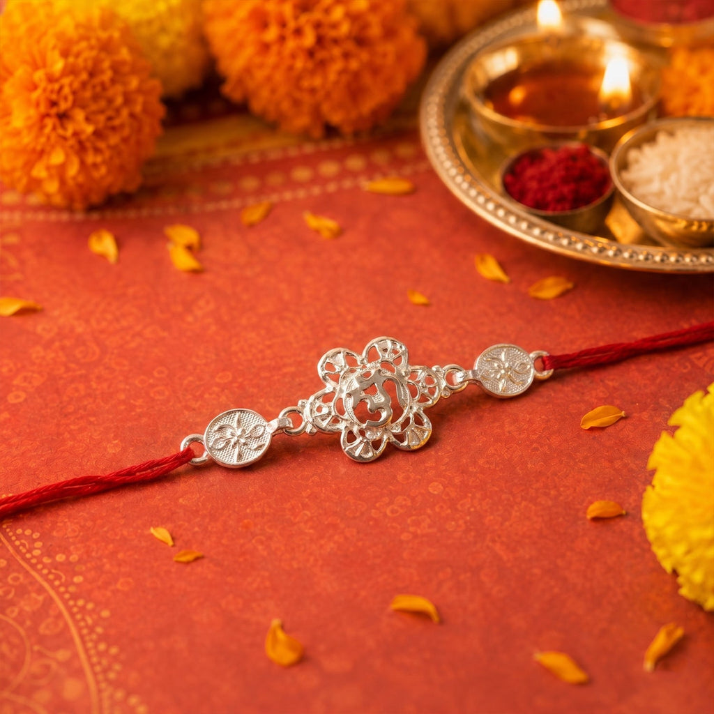 ALVENZA Silver Floral Om Rakhi – Elegant Red Thread for Rakshabandhan